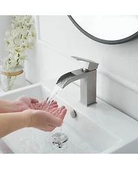 Waterfall Single Hole Single-Handle Low-Arc Bathroom Sink Faucet With Pop-up Drain Assembly In Brushed Nickel