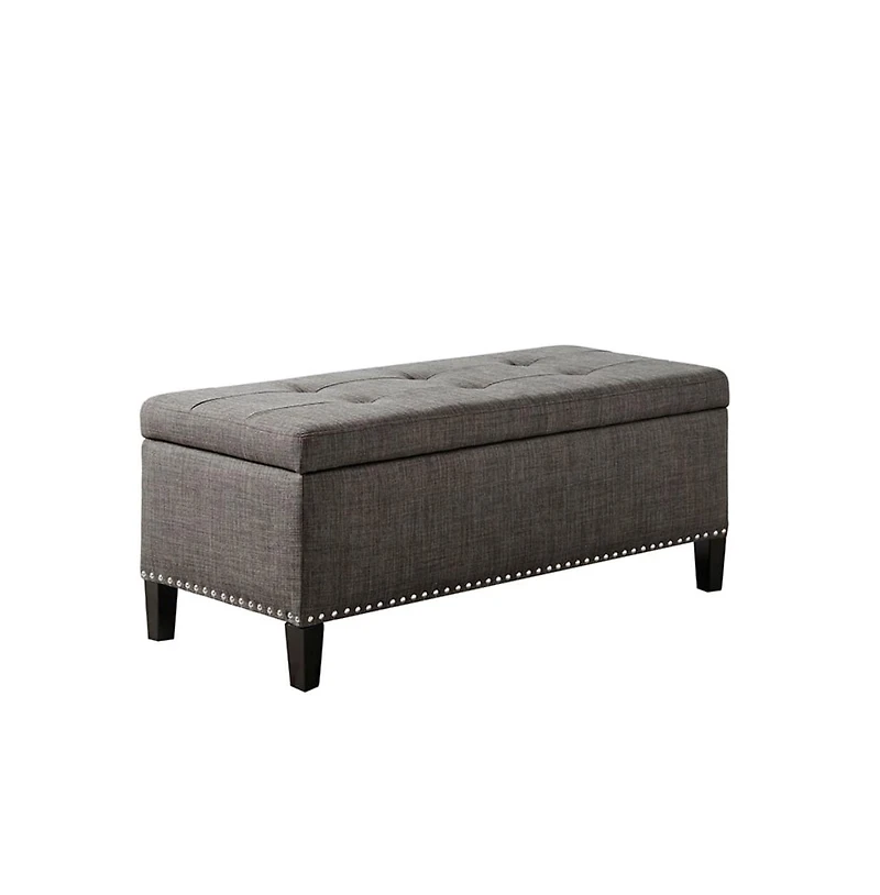 Modern tufted storage bench with soft-close lid, grey linen upholstery, button tufting, black wood legs, and interior for bedroom or entryway.