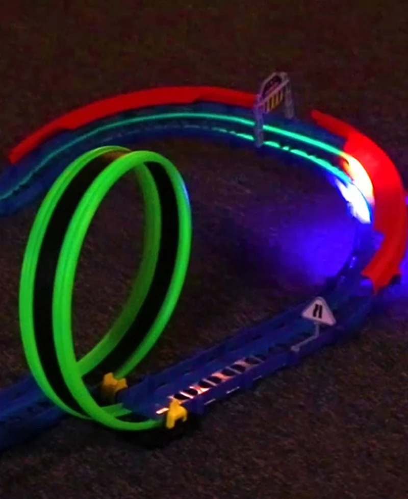 R/C car and track with three loops and glow trace technology.