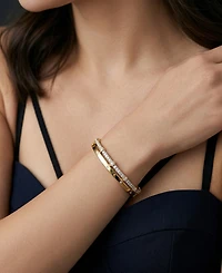 Wrapped Diamond (1/4 ct. t.w.) Bangle in 14k Yellow Gold Over Sterling Silver