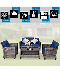 Gouun 4 Pieces Patio Rattan Furniture Set with Coffee Table and Cushioned Sofa