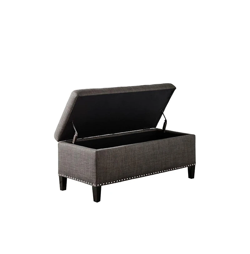 Modern tufted storage bench with soft-close lid, grey linen upholstery, button tufting, black wood legs, and interior for bedroom or entryway.
