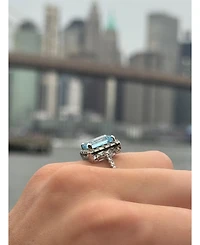 Suzy Levian New York Sterling Silver Emerald Cut Topaz Halo Ring