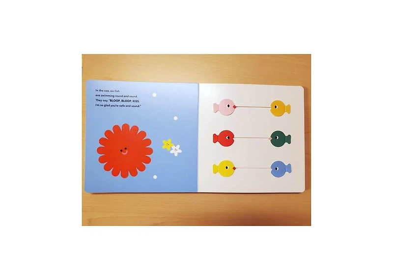 Kisses- A Lift-The-Flap Sliding Parts Book by Marta Comin