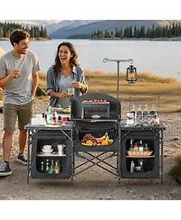 Mecale Camping Kitchen Table, Aluminum Portable Cook Station with 3 Storage Cupboards, Detachable Windscreen, Carrying Bag, Black