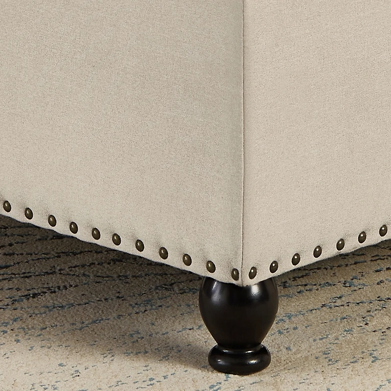 Streamdale Beige upholstered storage ottoman with wooden legs