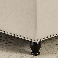Streamdale Beige upholstered storage ottoman with wooden legs