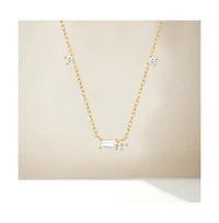 Hollywood Sensation 18K Gold Plated Sterling Silver Necklace with Three Round Cut and One Emerald Cut Cubic Zirconia Stones