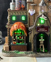 Glitzhome 11" Lighted Resin Halloween Haunted House Village