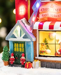 Glitzhome 10.75" Lighted Resin Christmas Toy Market Village