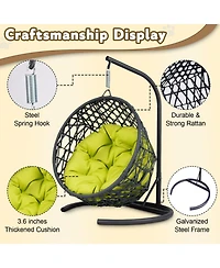 This rattan cat swing bed with cushion and stand provides a cozy swinging space for cats and small pets offering comfort and relaxation indoors