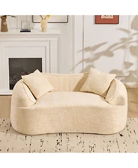 Streamdale Furniture Beige curved two-person compress sofa with armrests and two pillows.