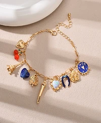 Nicole Miller Gold-Tone Eiffel Tower, Heart, Rose, Horseshoe, Clover, Cherry, and Amor Charms Bracelet