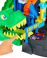Hot Wheels 1:64 scale City Ultimate T-Rex Garage with 2 Toy Cars & Storage for 50+, Race & Stunt, Dino Nemesis