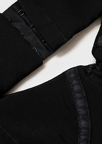 Dress with asymmetrical hem and cut-out
