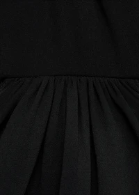 Dress with asymmetrical hem and cut-out
