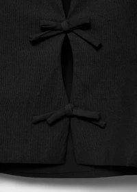 Top with bows on the back