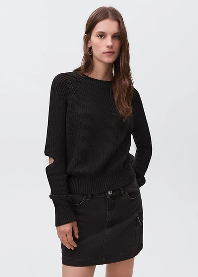 Knitted sweater with openings