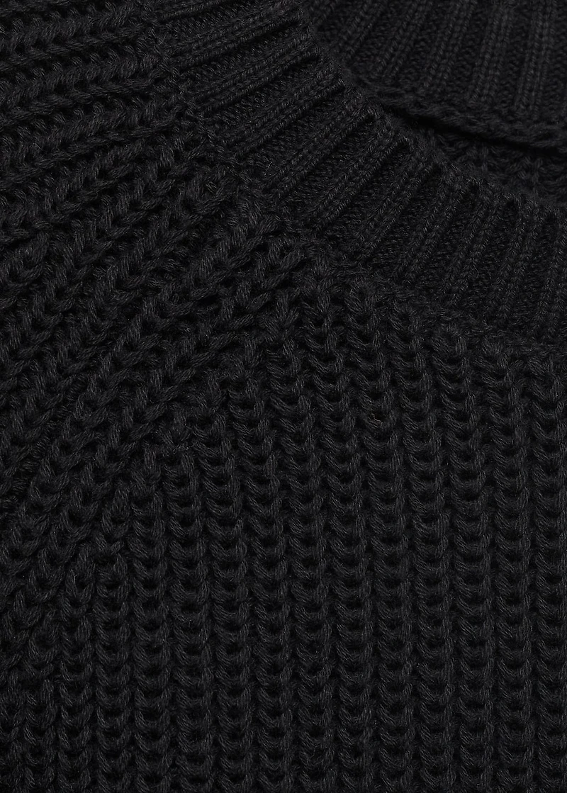 Knitted sweater with openings