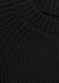 Knitted sweater with openings