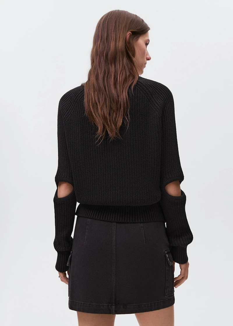 Knitted sweater with openings