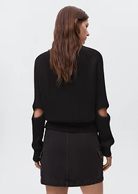 Knitted sweater with openings