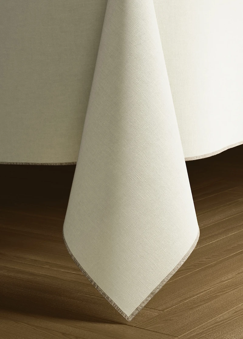 Resin-coated linen tablecloth with contrast overlock for 2 to 4 diners