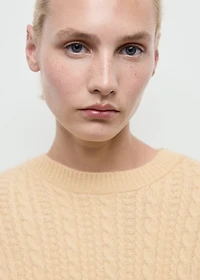 Cable-knit sweater with flared sleeves