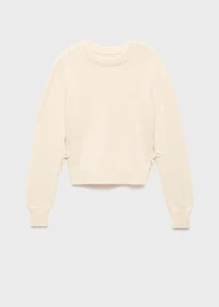 Knitted sweater with tie slits