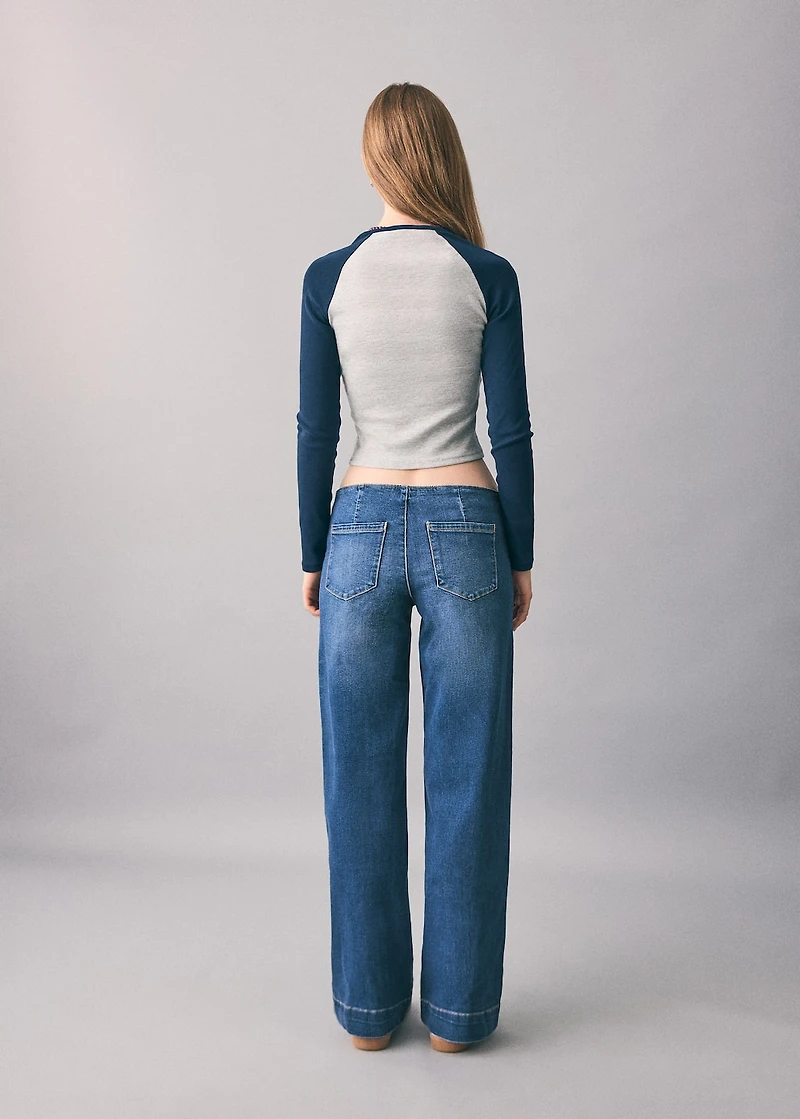 Low-waist studded jeans