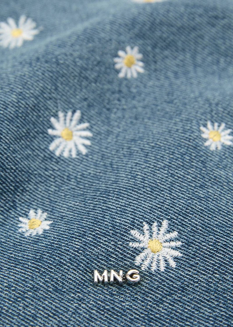 Denim toiletry bag embroidered with flowers