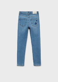 Star-embroidered skinny jeans