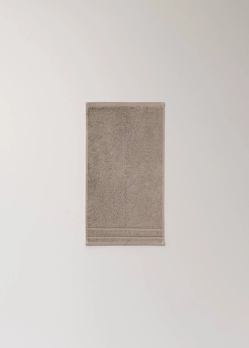 Cotton guest towel with embroidered dots
