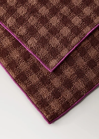 Cotton check-print guest towel with overlock stitching