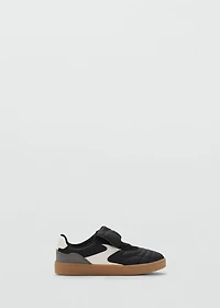 Sneakers with folded tongue
