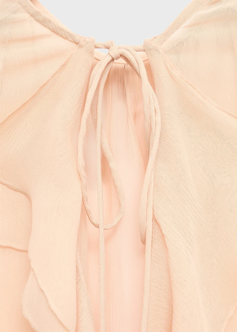 Ruffled blouse with flared sleeves