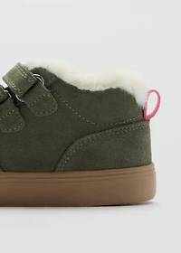 Leather and fur-effect trainers