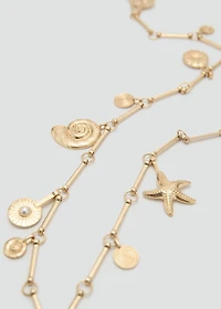 Metal belt with hanging pieces