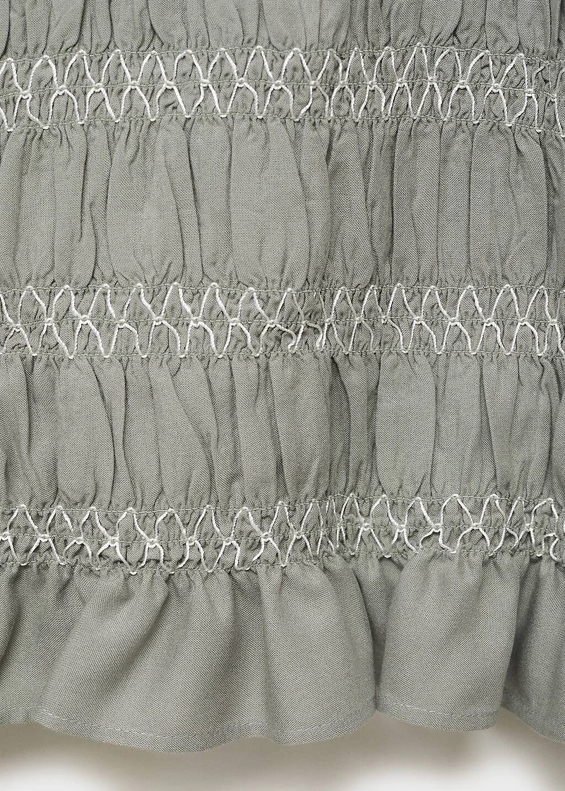 Ruffled blouse with embroidered details