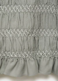 Ruffled blouse with embroidered details