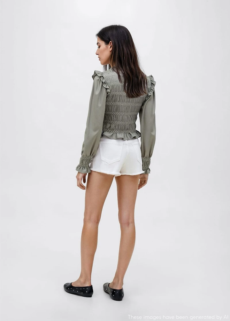 Ruffled blouse with embroidered details