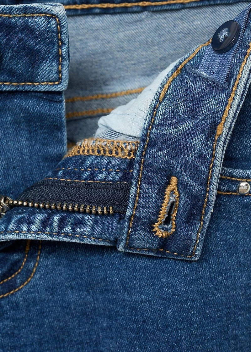 Low-waist studded jeans