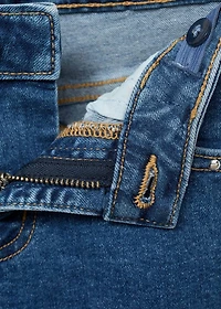Low-waist studded jeans