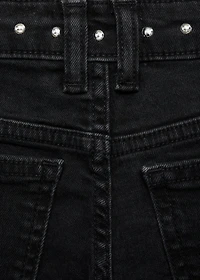 Low-waist studded jeans