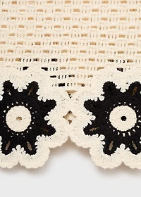 Crochet top with floral finishes