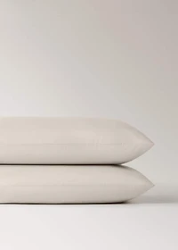 Two 500-thread count cotton percale pillowcases with rounded piping detail 50x75 cm