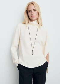 High-neck blouse with asymmetric sleeves