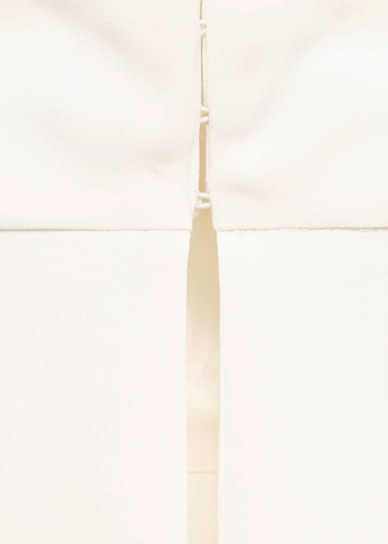 High-neck blouse with asymmetric sleeves