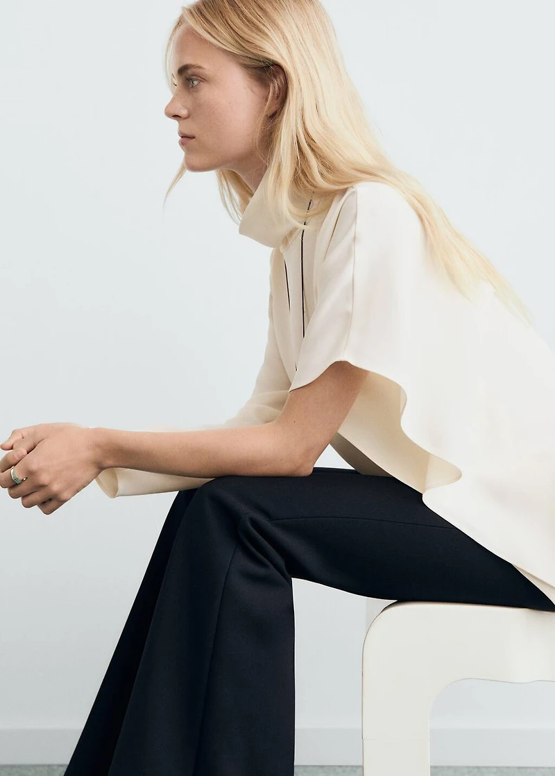 High-neck blouse with asymmetric sleeves
