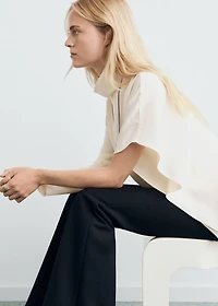 High-neck blouse with asymmetric sleeves